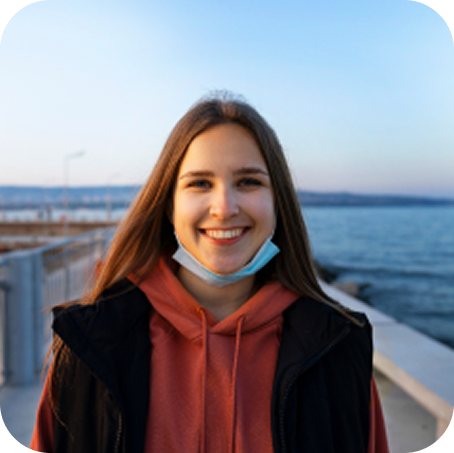 front view smiley woman seaside 1